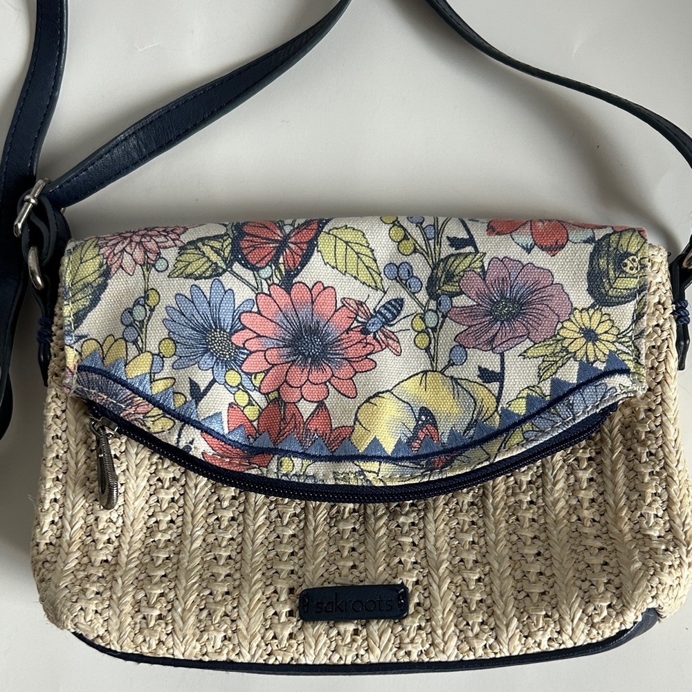Sakroots floral canvas/straw look crossbody fold over bag.